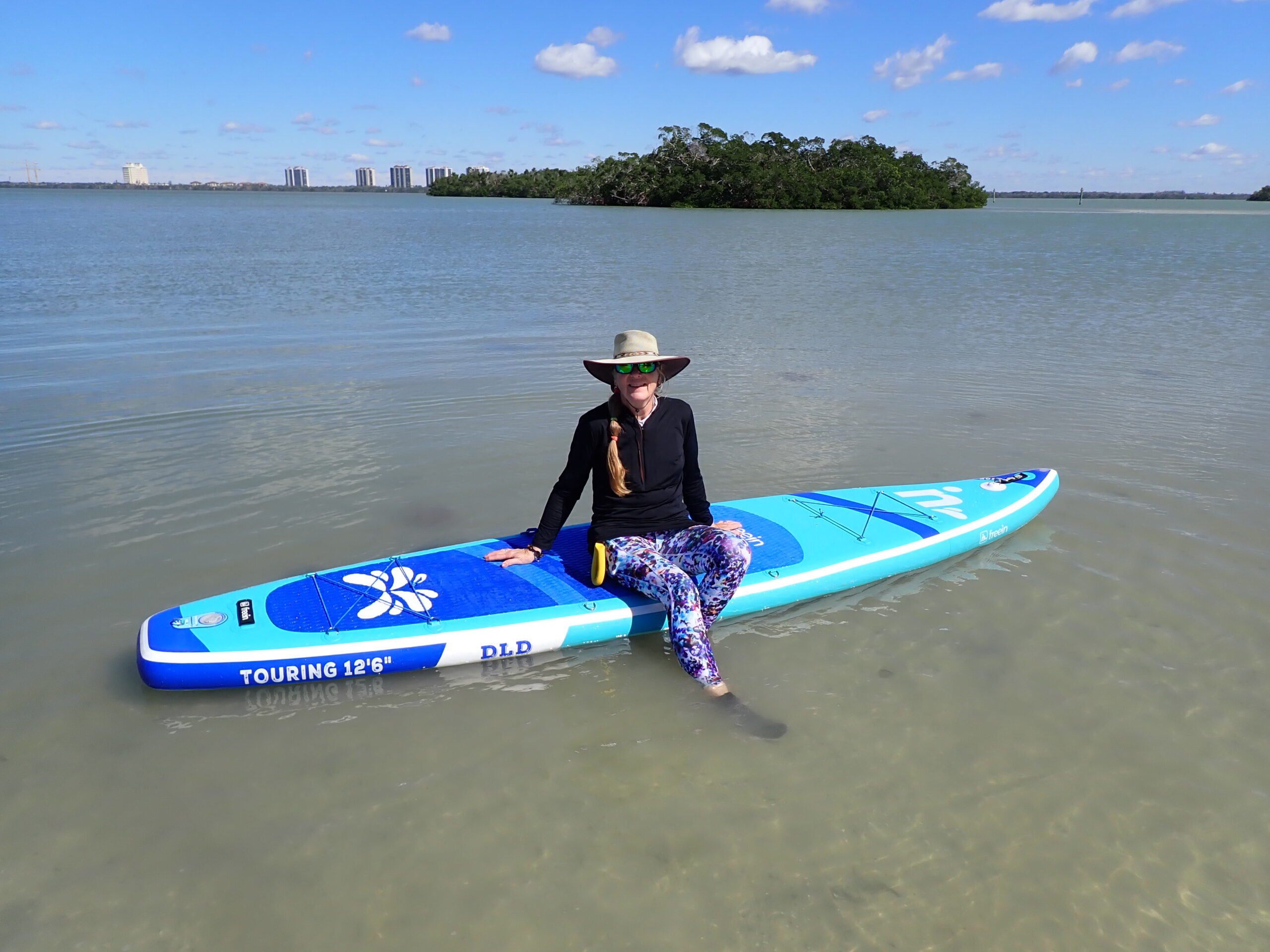 sheree Lincoln on the water with paddle board